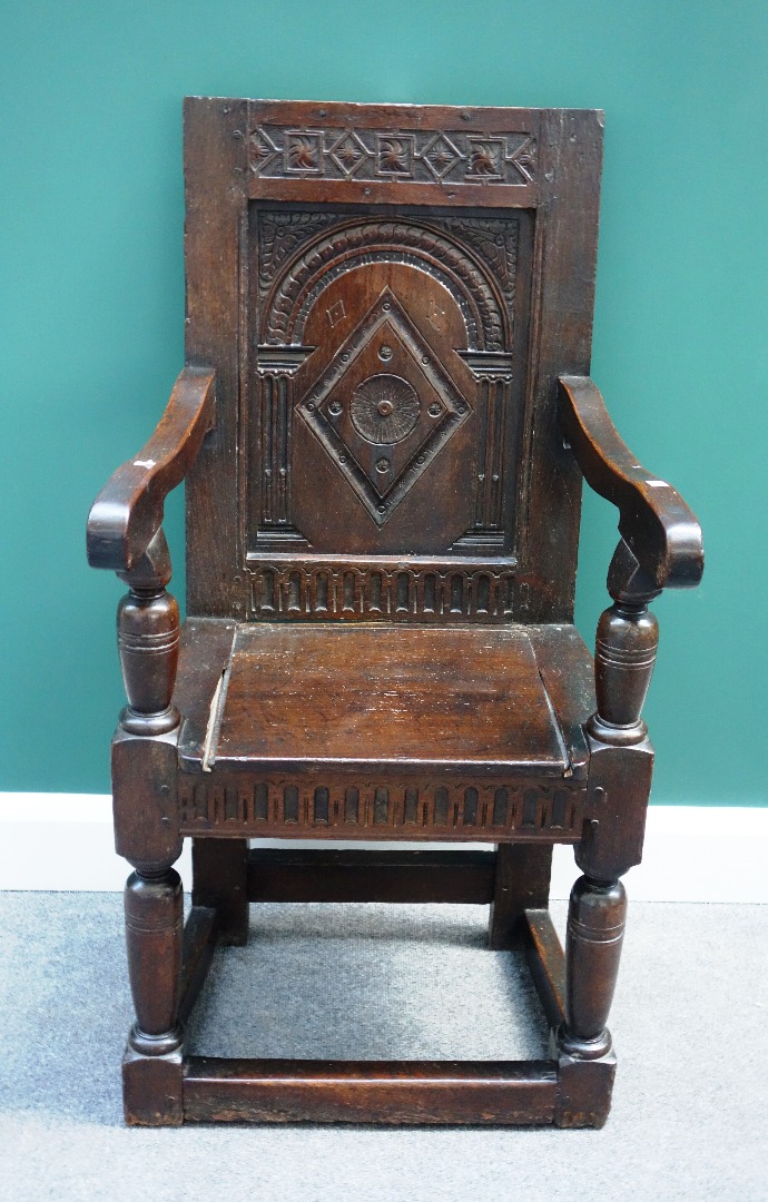 Appraisal: A th century and later oak Wainscot chair with carved