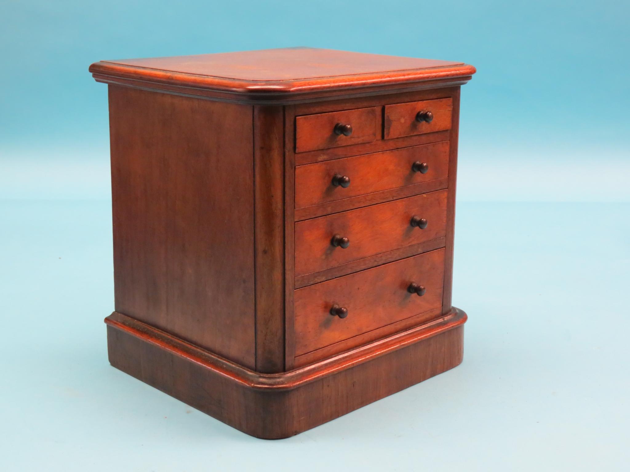 Appraisal: A Victorian miniature mahogany chest two short and three long