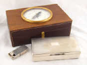 Appraisal: A leather cased hardwood humidor the lid with large compass