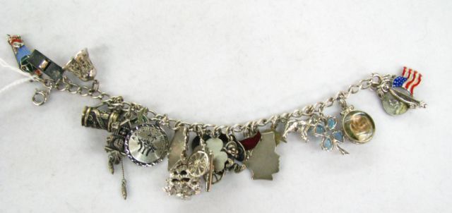 Appraisal: Sterling silver vintage charm bracelet with charms most charms are