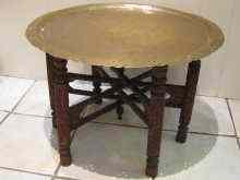 Appraisal: A Benares brass table with pierced rim cm diameter on