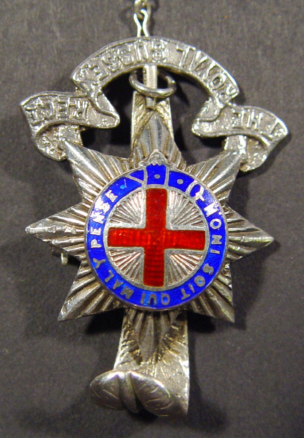 Appraisal: Silver Military badge with enamelled Royal Sussex Regiment crest cm