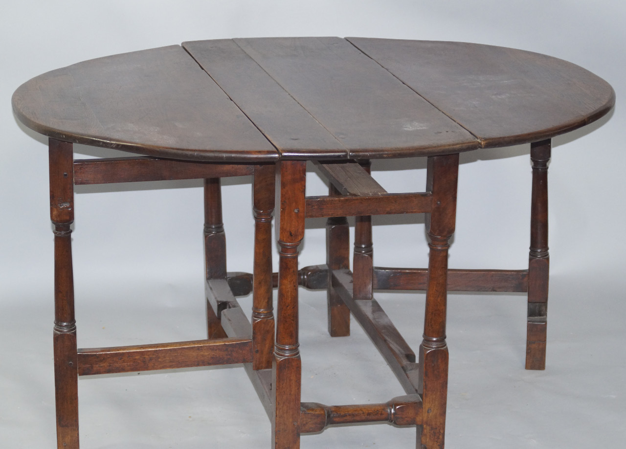 Appraisal: A principally thC oak plank top dining table the D-end