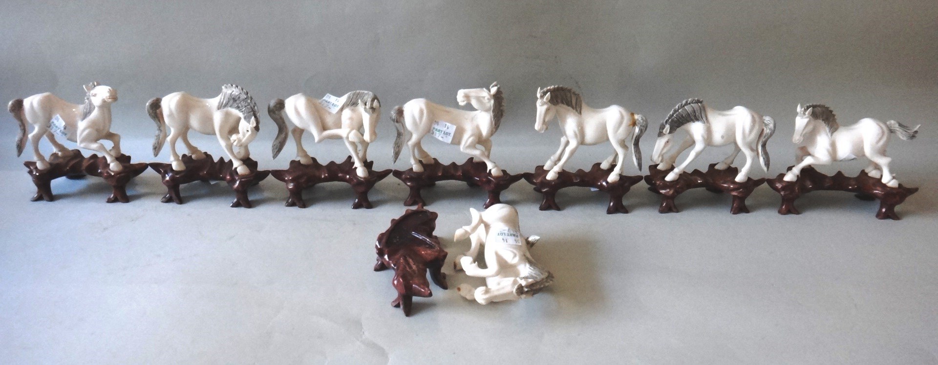 Appraisal: A group of eight Chinese ivory carvings of standing horses