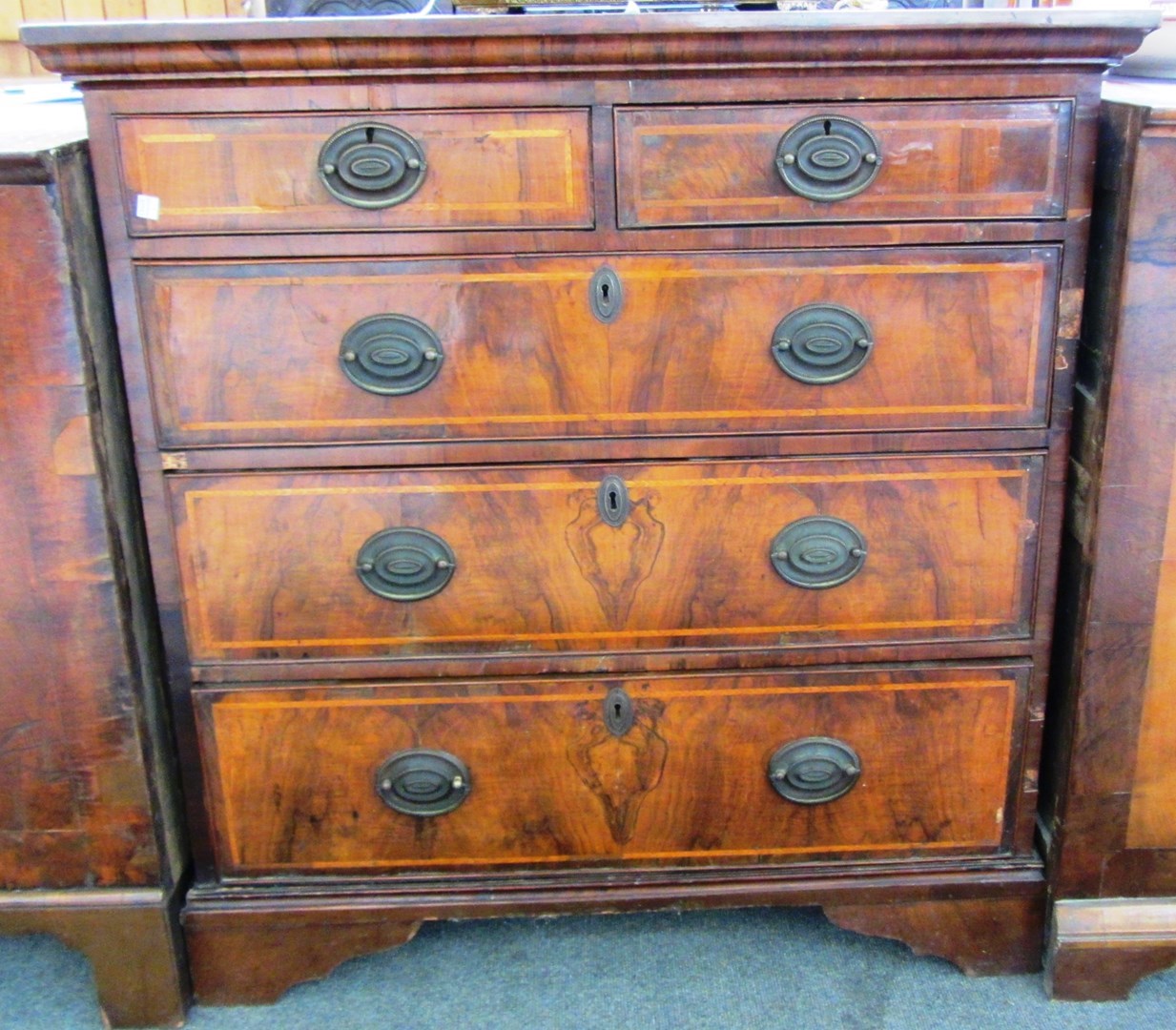 Appraisal: An early th century and later feather banded walnut chest