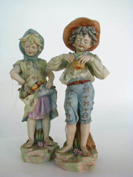 Appraisal: Pair of Bisque Figures depicting a boy and girl picking