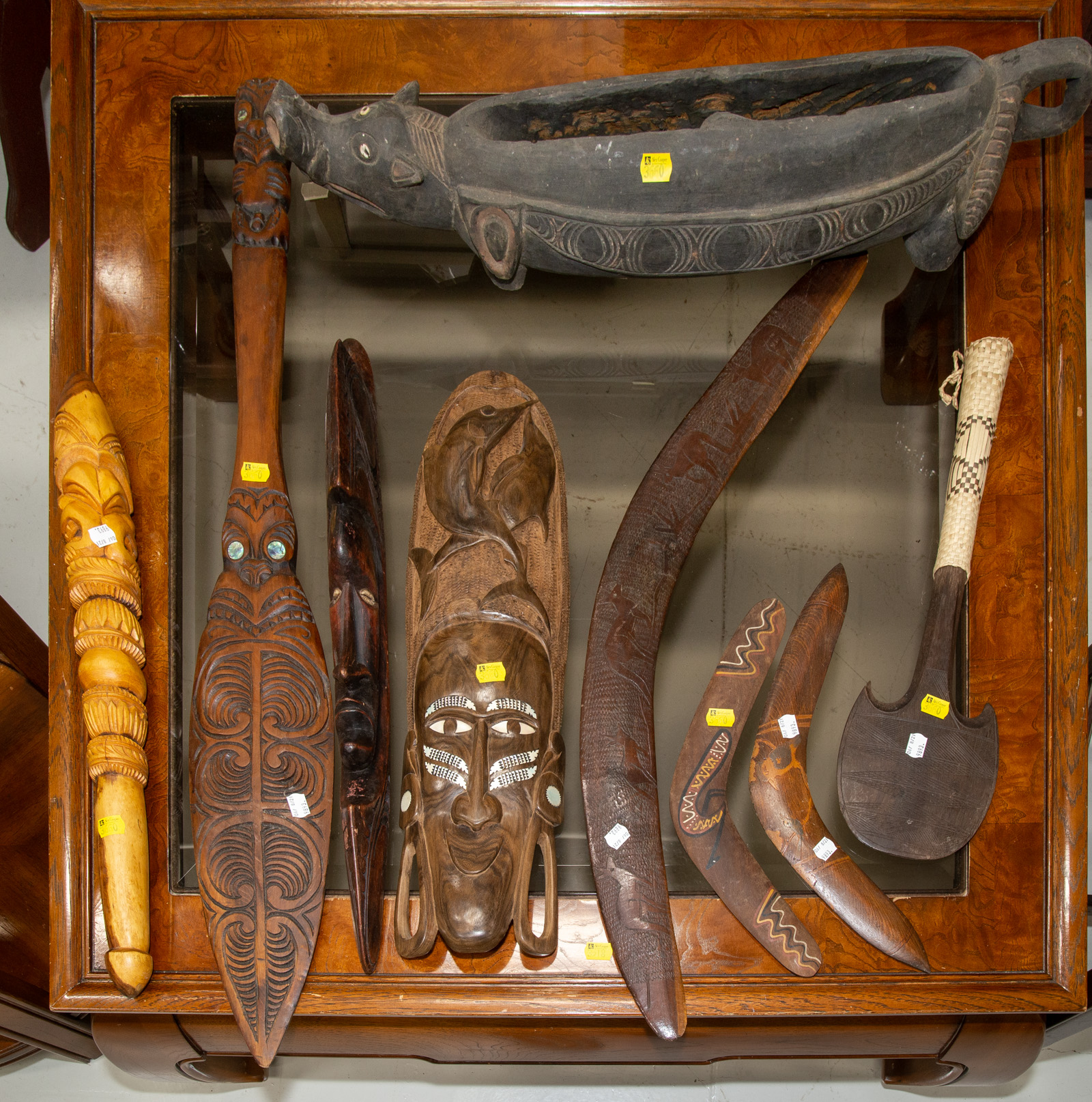 Appraisal: ASSORTMENT OF DECORATIVE INDIGENOUS WOOD CARVINGS Includes three boomerangs a