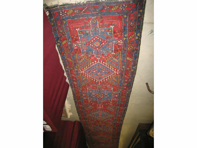 Appraisal: Heriz Persian Handmade Runner geometrics medallions rich colors deep pile