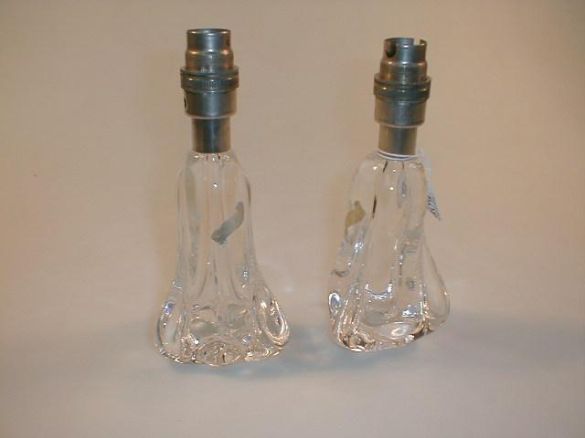 Appraisal: A pair of clear glass lamp bases marked Faitmain -