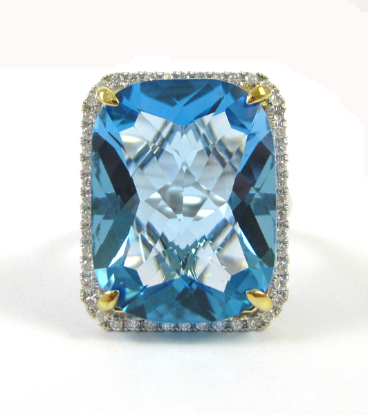 Appraisal: BLUE TOPAZ DIAMOND AND FOURTEEN KARAT GOLD RING The white