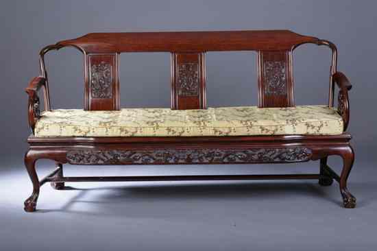 Appraisal: CHINESE CARVED ROSEWOOD SETTEE Carved with dragon-form handles and openwork