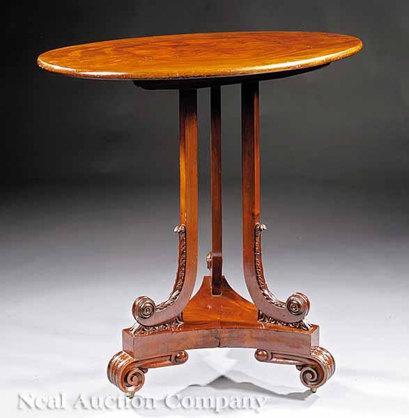 Appraisal: An American Classical Carved Mahogany Tilt-Top Candlestand oval top scrolled