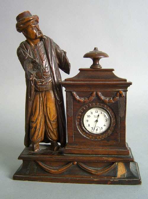 Appraisal: Carved mahogany watch hutch th c with carved Chinese figure