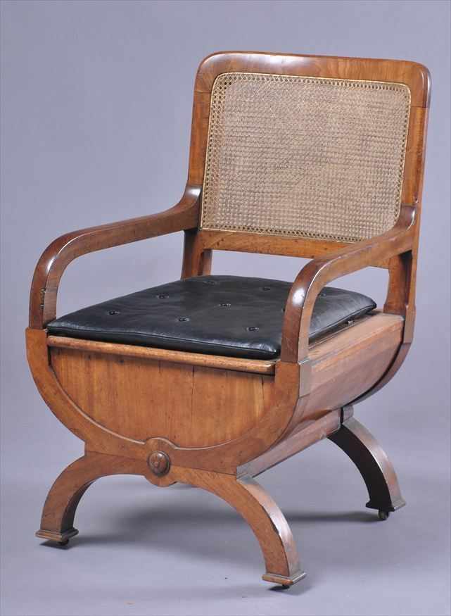 Appraisal: REGENCY MAHOGANY CURULE-FORM COMMODE ARMCHAIR MARKED GILLOWS The curved cane