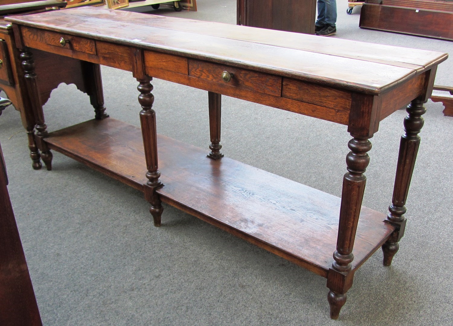 Appraisal: A mid th century French hall serving table with pair