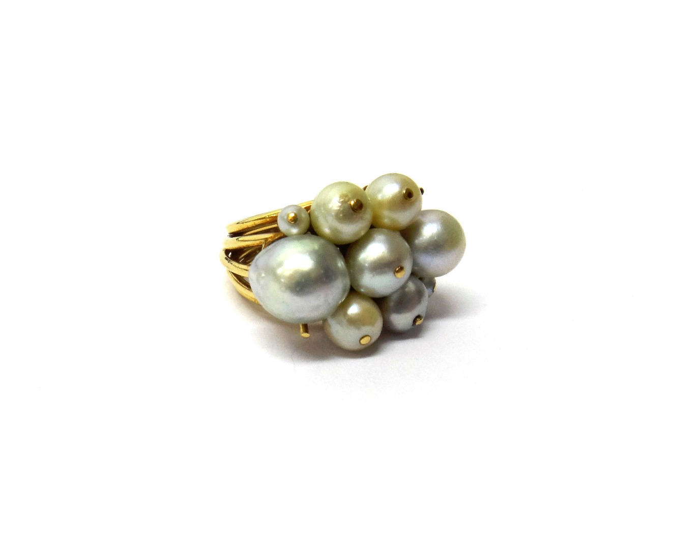 Appraisal: A gold and cultured pearl ring mounted with nine cultured