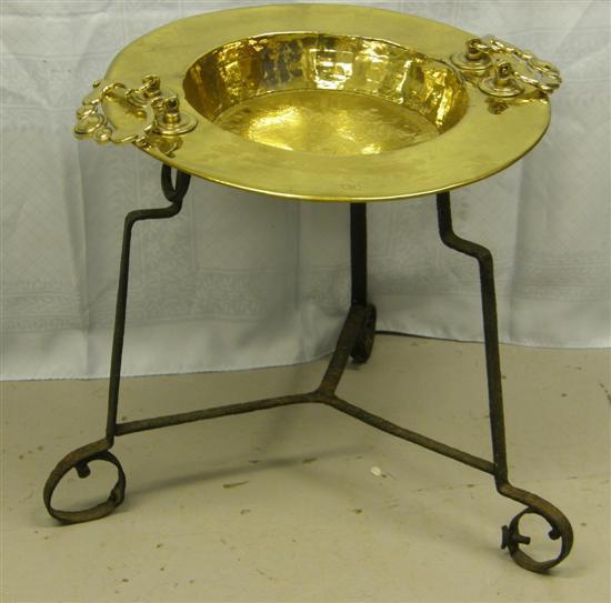 Appraisal: Brass twin handled circular dish on wrought iron tripod stand