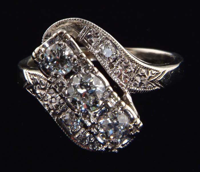 Appraisal: K WHITE GOLD AND DIAMOND LADIES RING Centered three diamonds