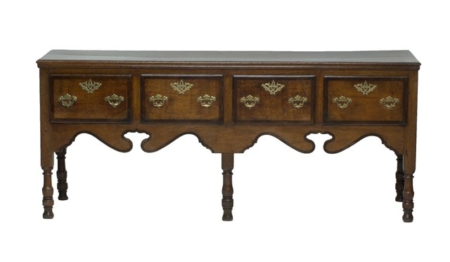 Appraisal: An th century mahogany banded oak four drawer dresser base