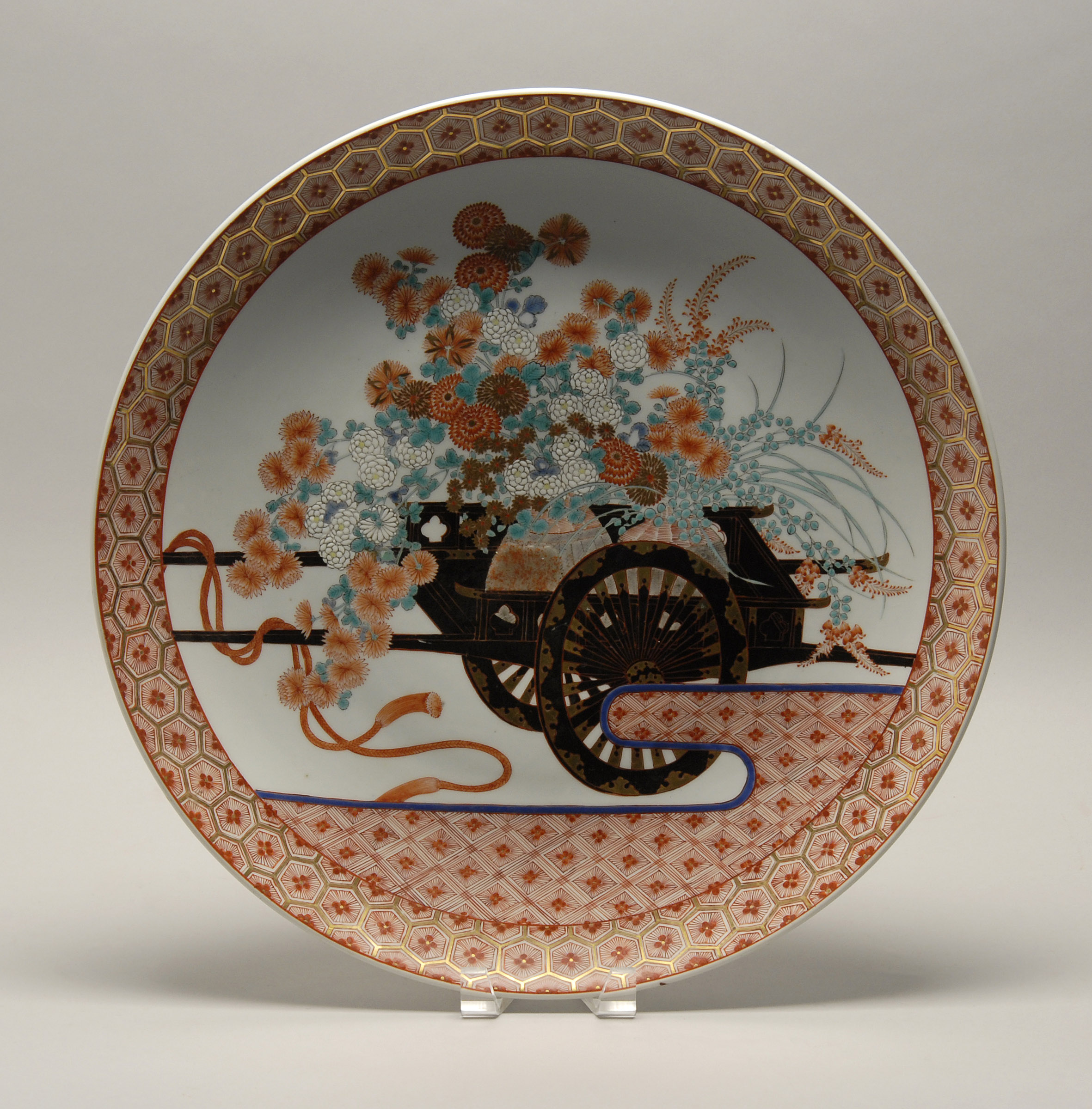 Appraisal: RUST-RED AND GOLD PORCELAIN CHARGER th CenturyDepicting a flower cart