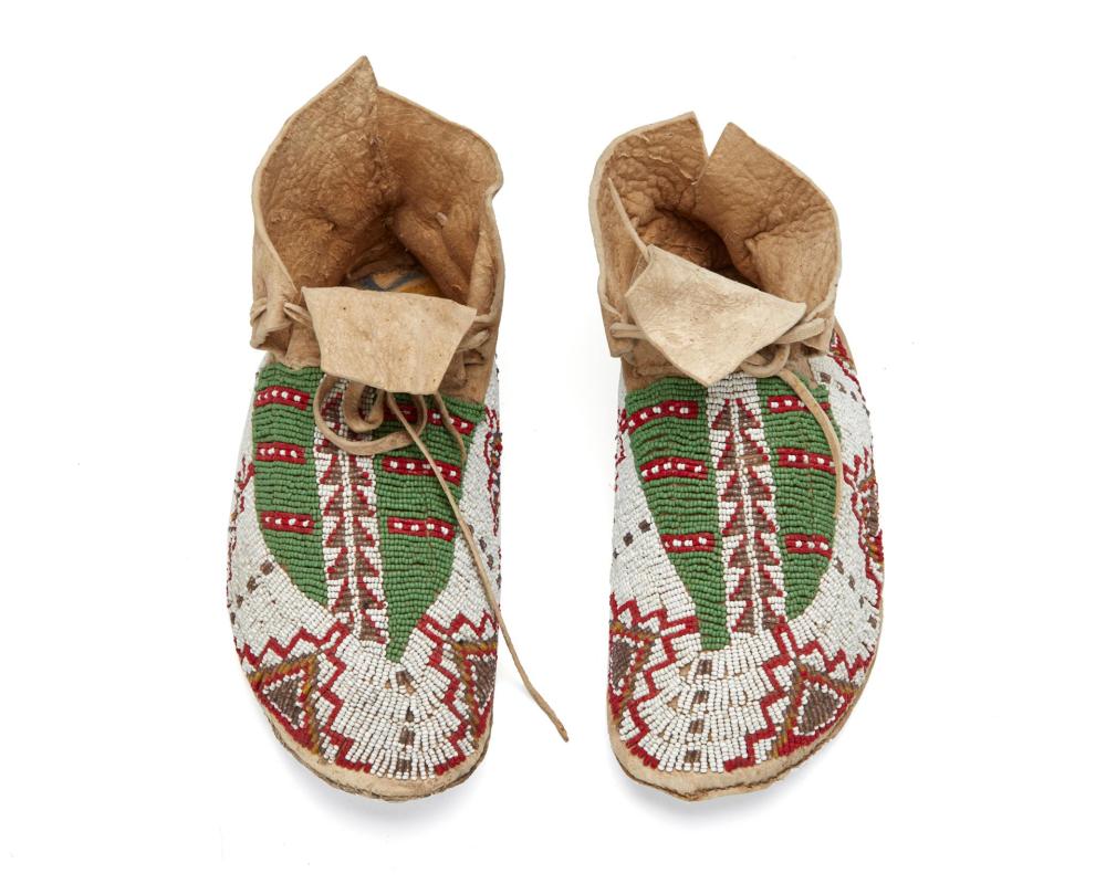 Appraisal: A pair of Plains Indian beaded hide moccasins First-Quarter th