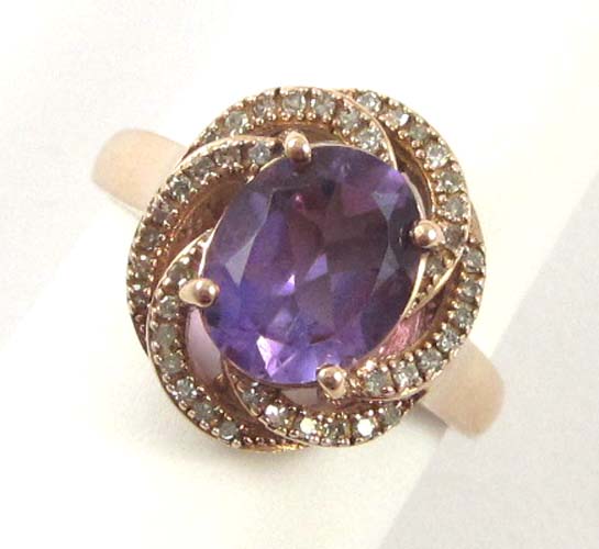 Appraisal: AMETHYST DIAMOND AND FOURTEEN KARAT ROSE GOLD RING with round-cut