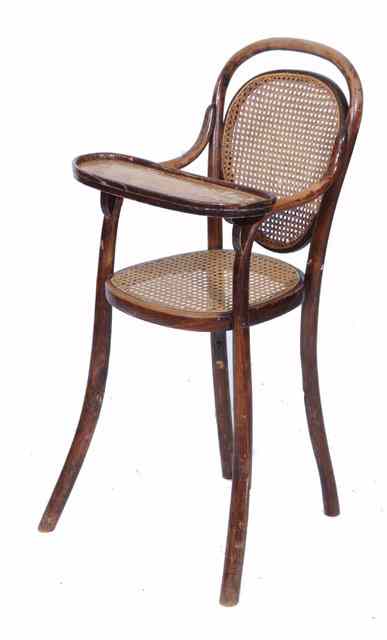 Appraisal: AN OLD BEECH BENTWOOD CHILD'S HIGH CHAIR with caned back