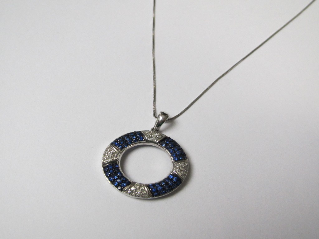 Appraisal: Fourteen carat white gold sapphire and diamond open circular pendant