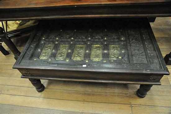 Appraisal: AN INDIAN BRASS BOUND COFFEE TABLE WITH INSET TEMPLE DOORS