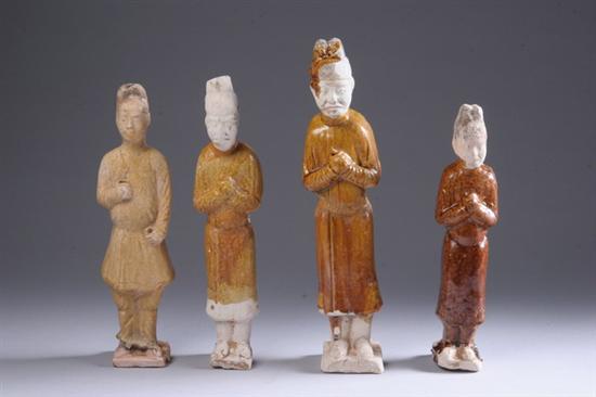 Appraisal: FOUR CHINESE GLAZED POTTERY FIGURES OF ATTENDANTS Tang Dynasty -