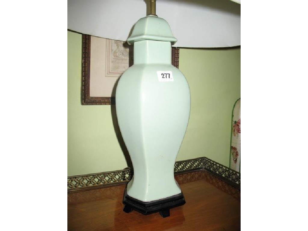 Appraisal: A CHINESE STYLE GREEN CELADON VASE of faceted baluster form