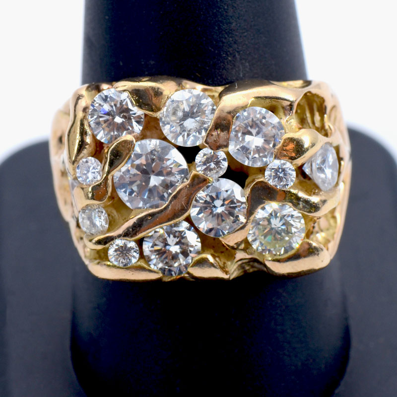 Appraisal: K CT DIAMOND RING K yellow gold nugget ring contains