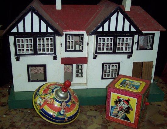 Appraisal: A doll's house circa a spinning top and a jack-in-the-box