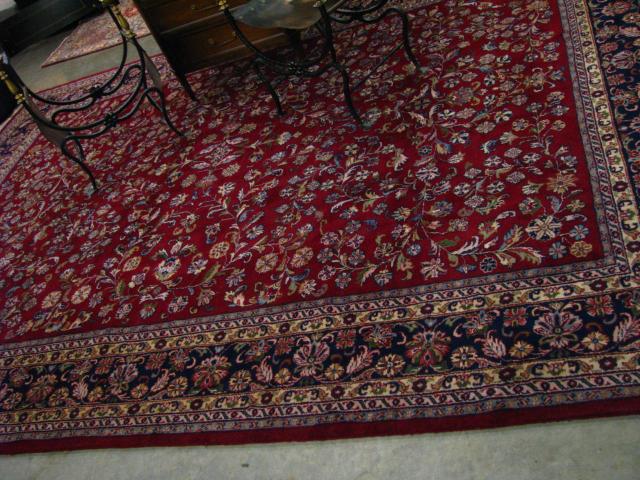 Appraisal: Indo-Kashan ' x hand made rug red field with blue