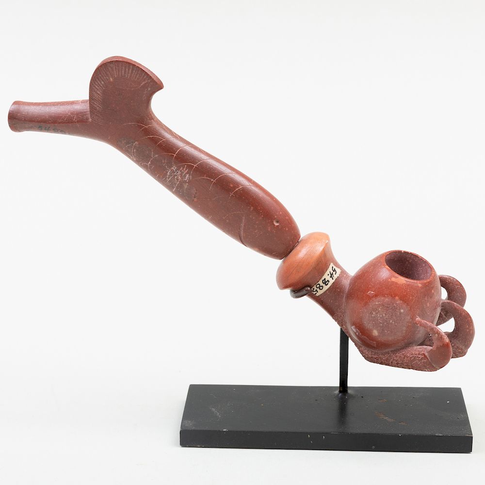 Appraisal: Northern Plains Carved Catlinite Pipe Now raised on a stand