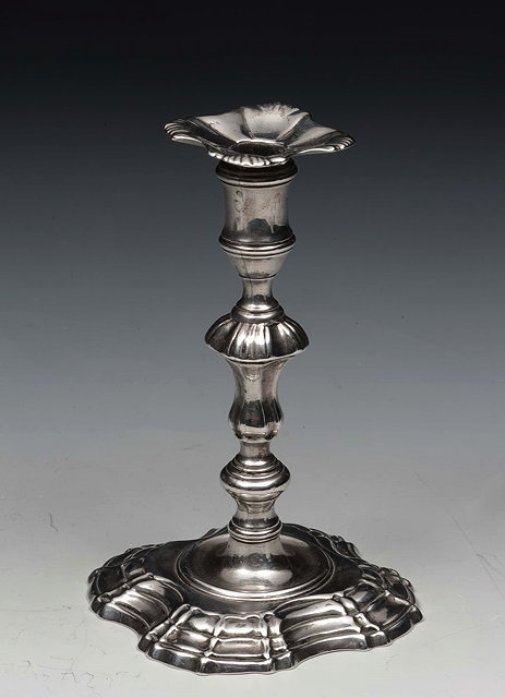 Appraisal: A GEORGE II SILVER TAPER STICK with shaped base matching