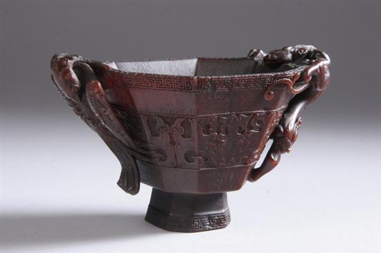 Appraisal: CHINESE RHINOCEROS HORN LIBATION CUP th th century Octagonal-form exterior