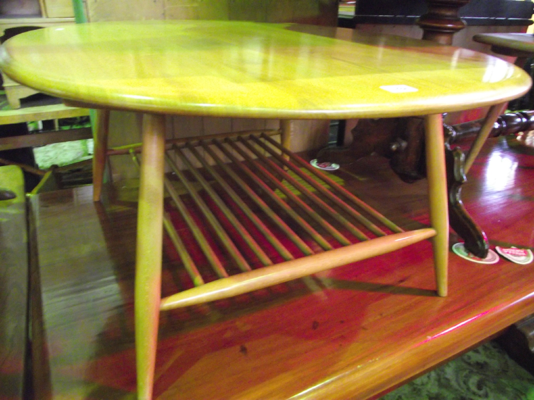 Appraisal: A vintage Ercol light elm and beechwood occasional table of