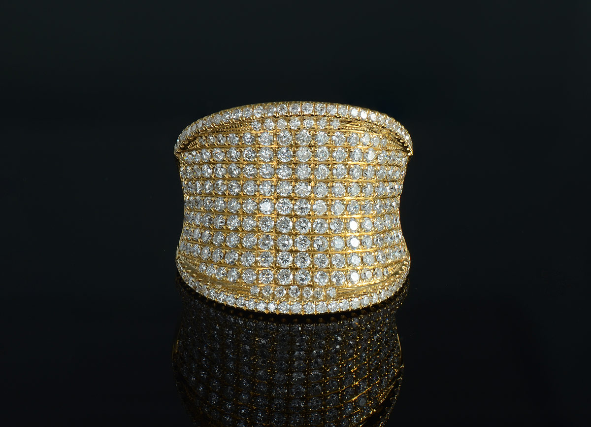 Appraisal: K PAVE DIAMOND RING K yellow gold ring paved in