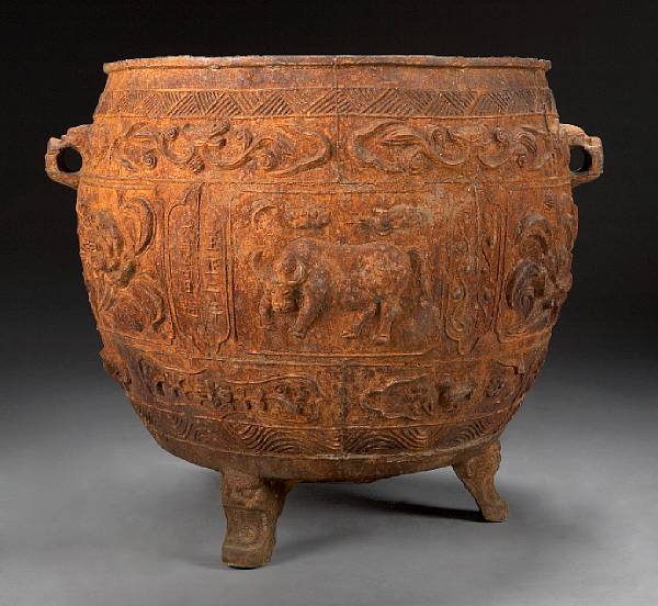 Appraisal: A Chinese cast iron cistern Of ovoid form with relief