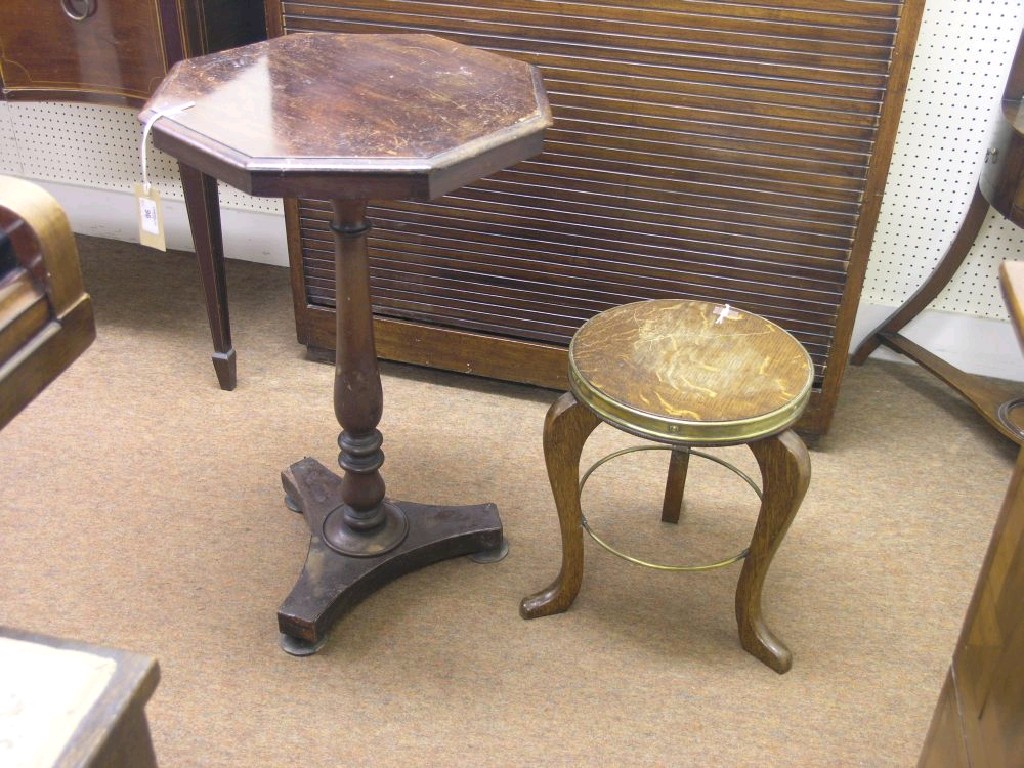 Appraisal: A Victorian mahogany wine table octagonal top on baluster turned