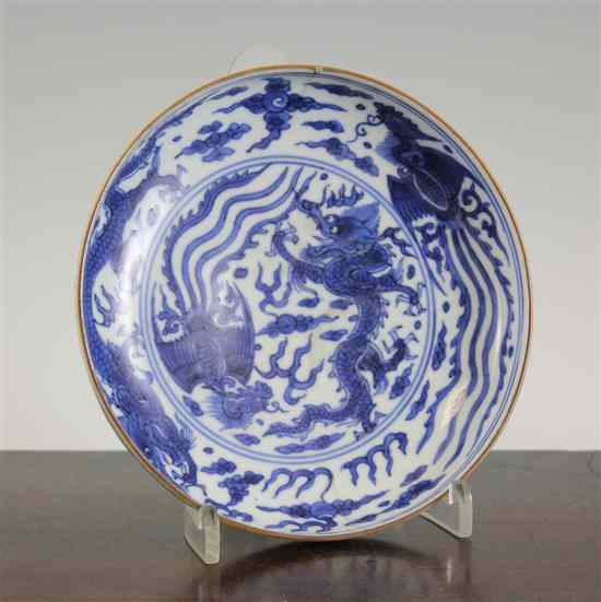 Appraisal: A Chinese blue and white dragon and phoenix dish Jiajing