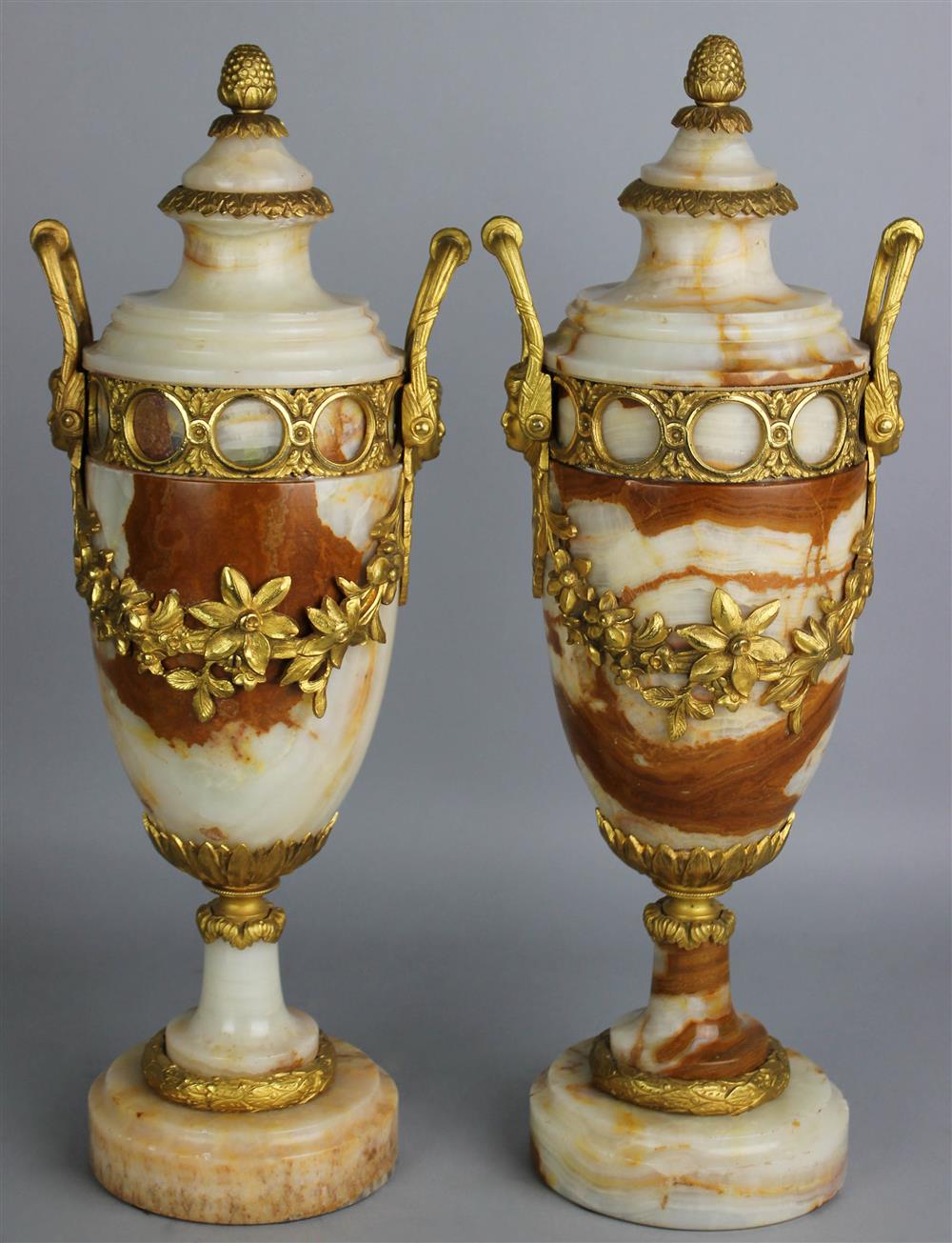 Appraisal: PAIR OF CONTINENTAL NEOCLASSICAL STYLE GILT BRONZE MOUNTED AGATE URNS