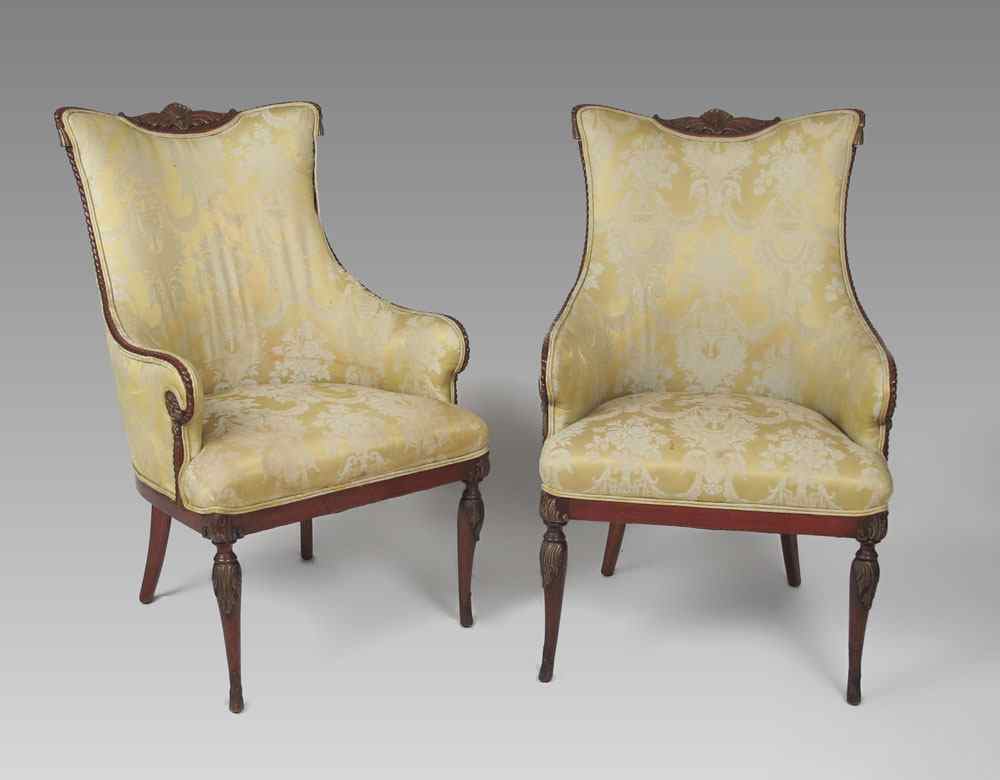 Appraisal: PAIR OF CARVED AND UPHOLSTERED SIDE CHAIRS Carved crest with