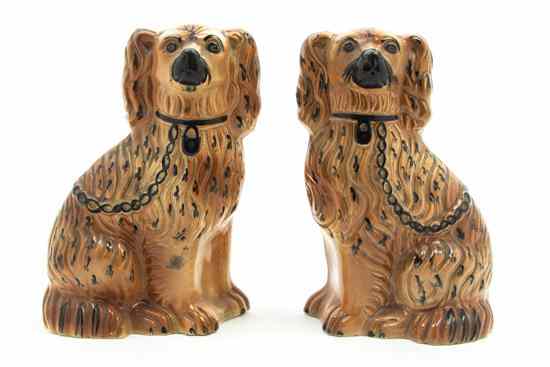 Appraisal: A Pair of Staffordshire Spaniels of typical form Height inches