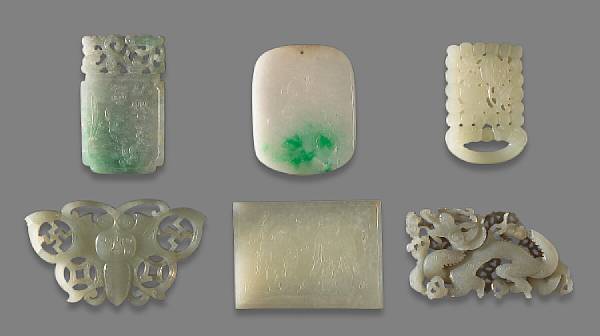 Appraisal: A group of six carved jade decorations The pale greenish