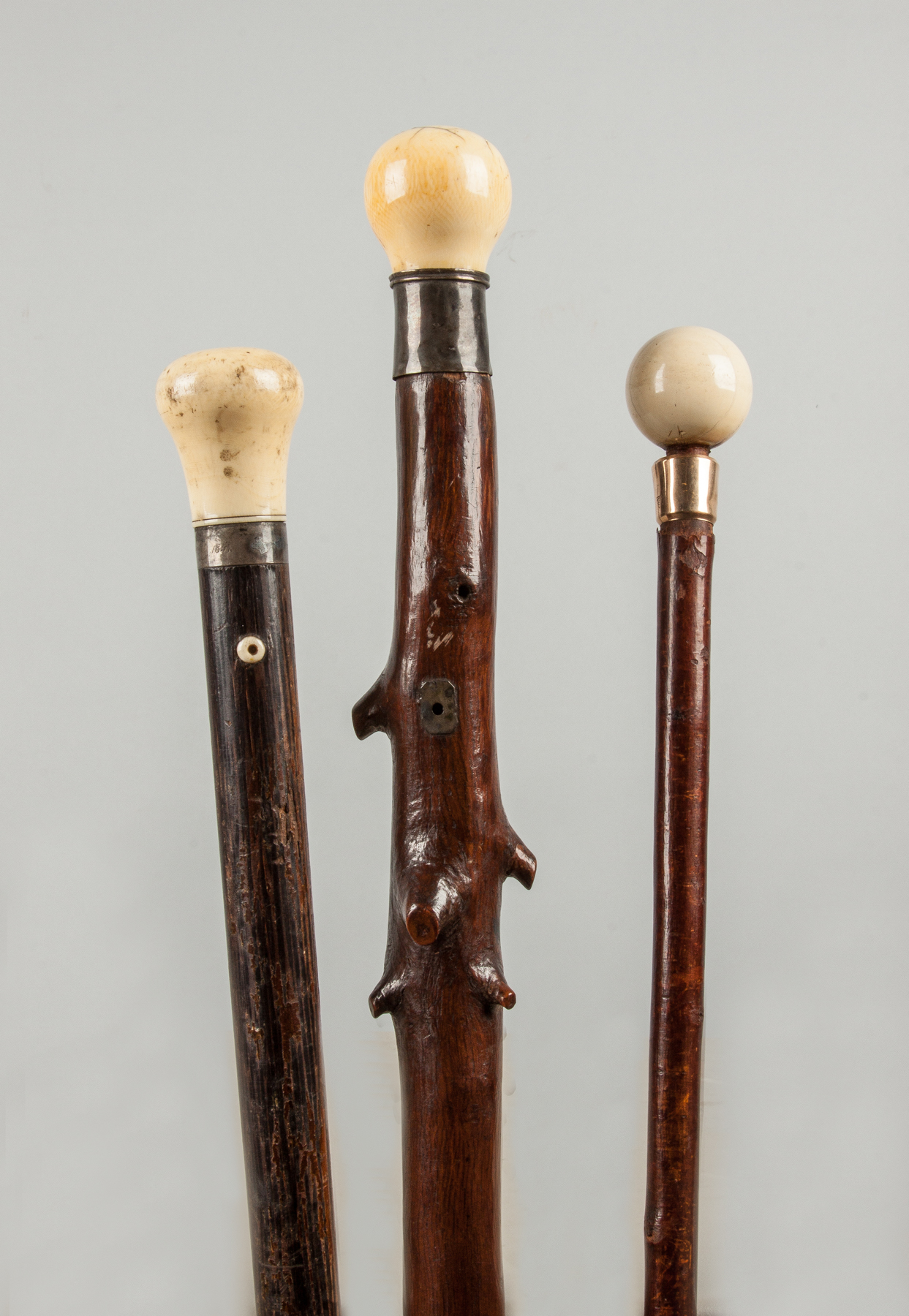 Appraisal: Three Rustic Wood Canes with Rounded Handles Late th early