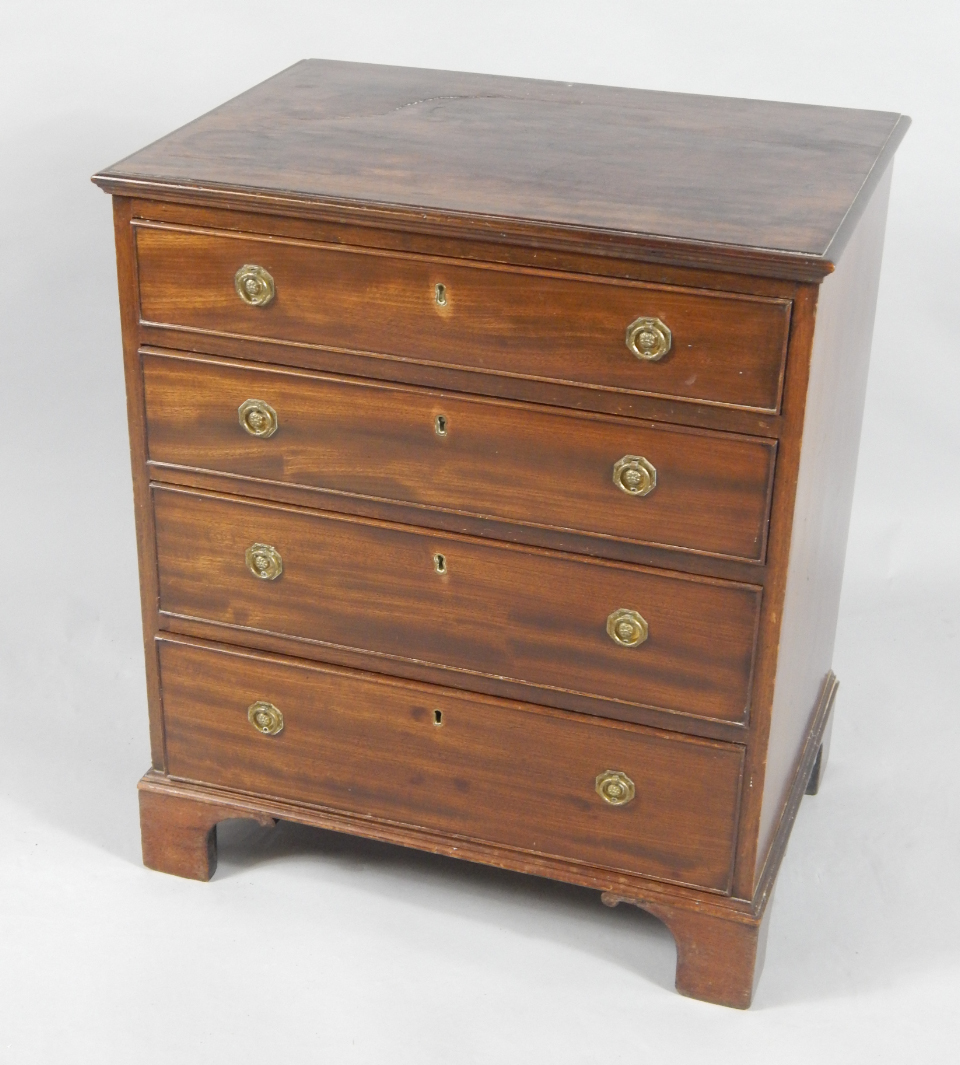 Appraisal: A George III mahogany bachelor's chest of four graduated drawers