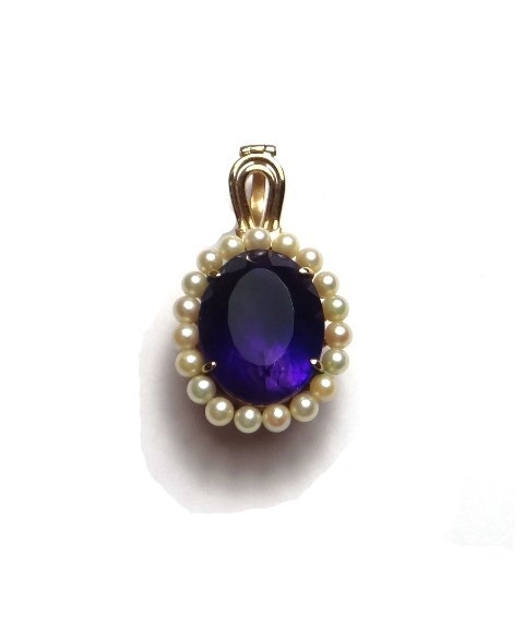 Appraisal: A gold amethyst and cultured pearl set pendant claw set