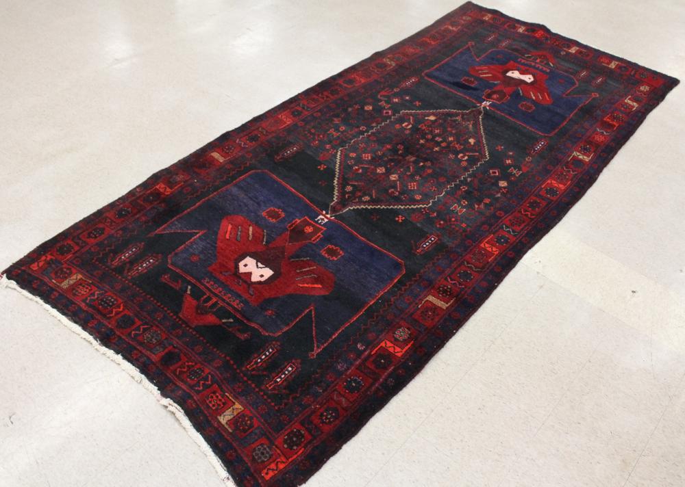 Appraisal: HAND KNOTTED PERSIAN TRIBAL CARPET geometric design on dark blue